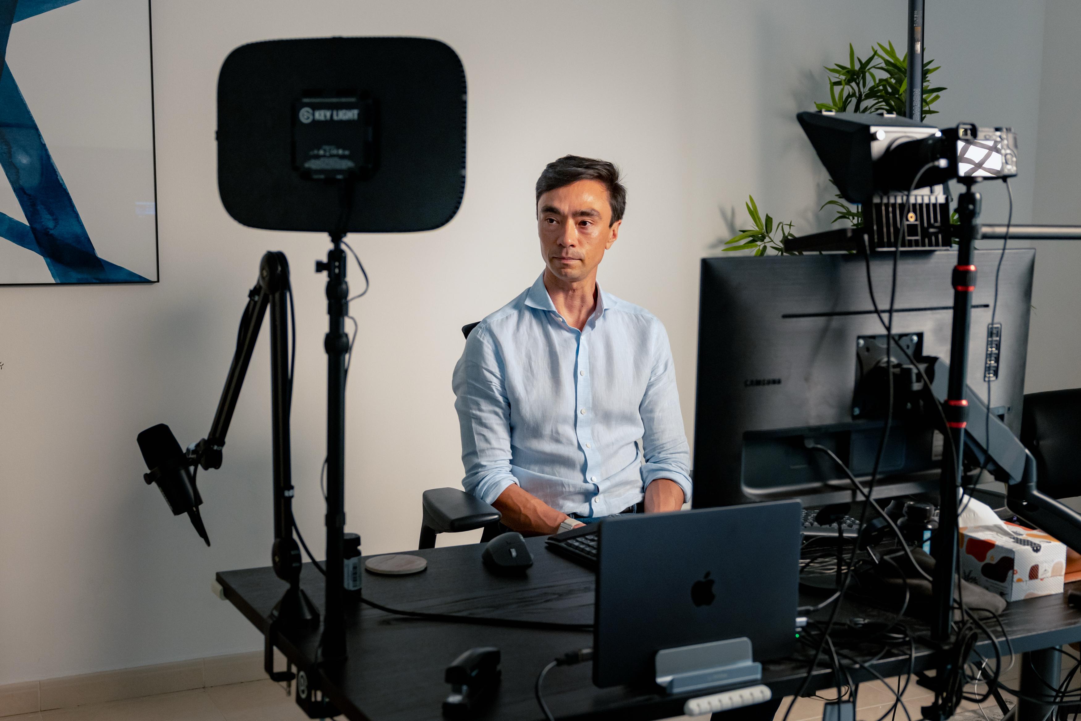 Alex Scott at his desk with his recording and remote working setup